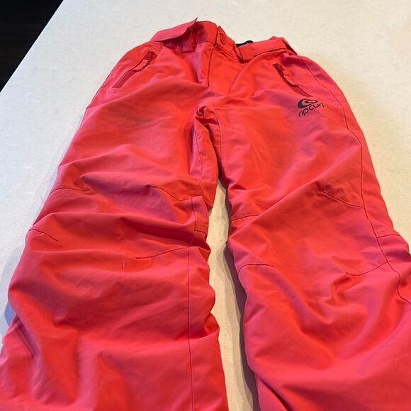Rip curl kids ski pantssize 10 grapefruit few stains and small cuts Work fine.